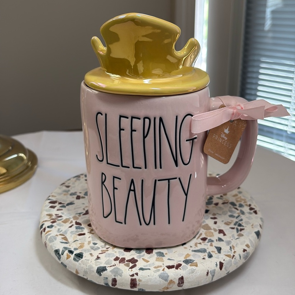 Rae Dunn Sleeping Beauty mug with crown topper